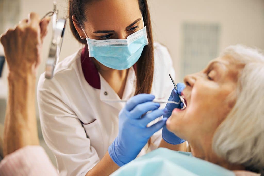 Dental Implants vs Dentures: Pros and Cons Explained