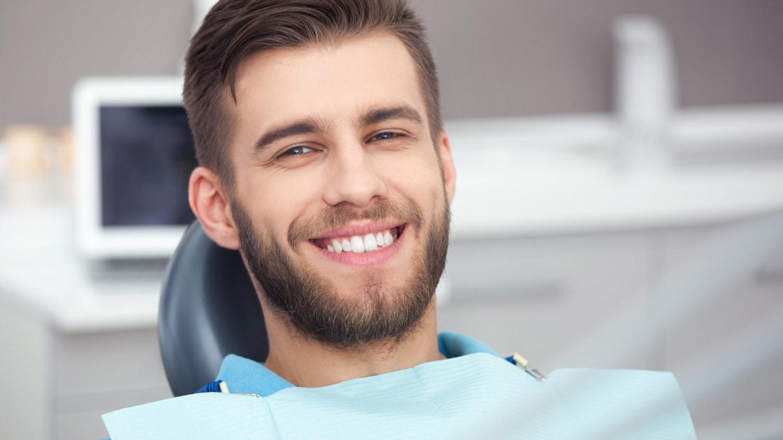 New Patient Smiling in Chair